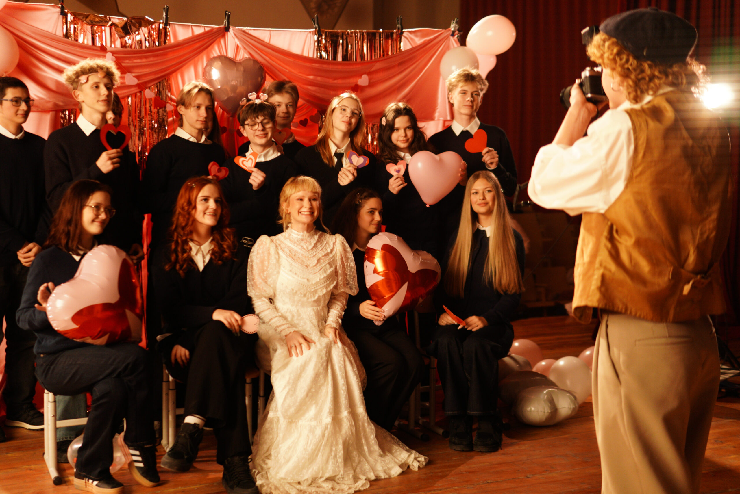 Monetochka and the school-scene cast posing for a photograph