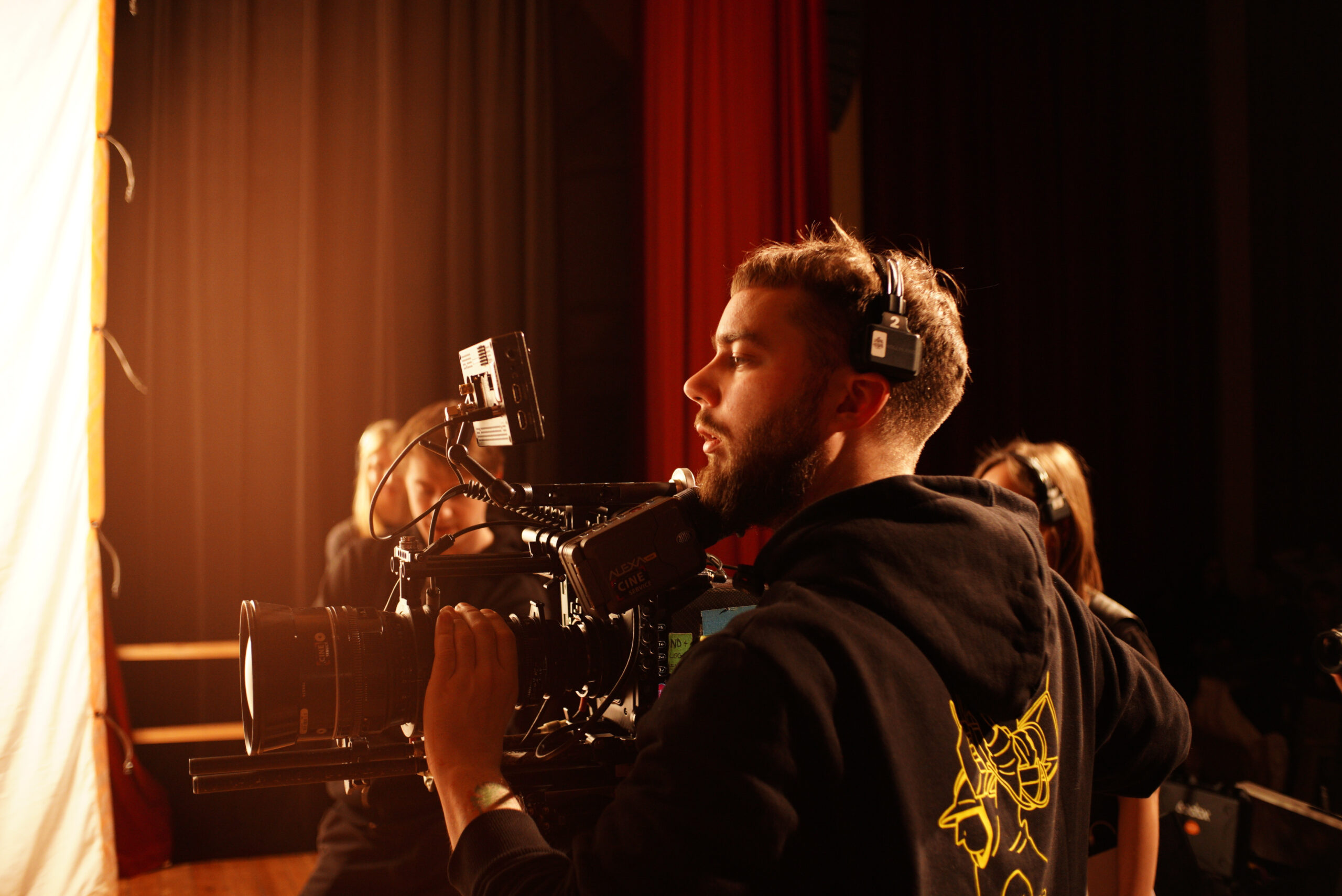 Camera operator filming the school scenes