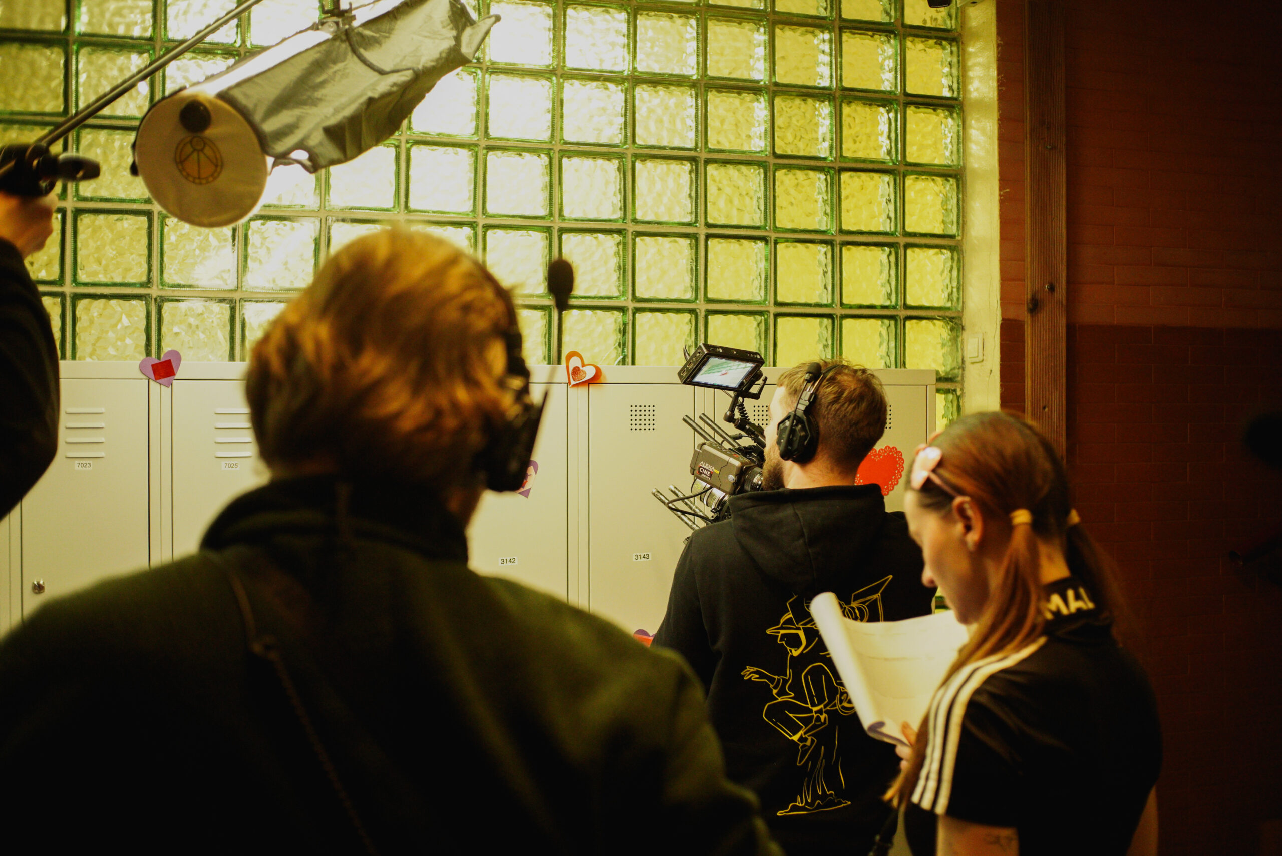 Camera crew filming in the school corridor