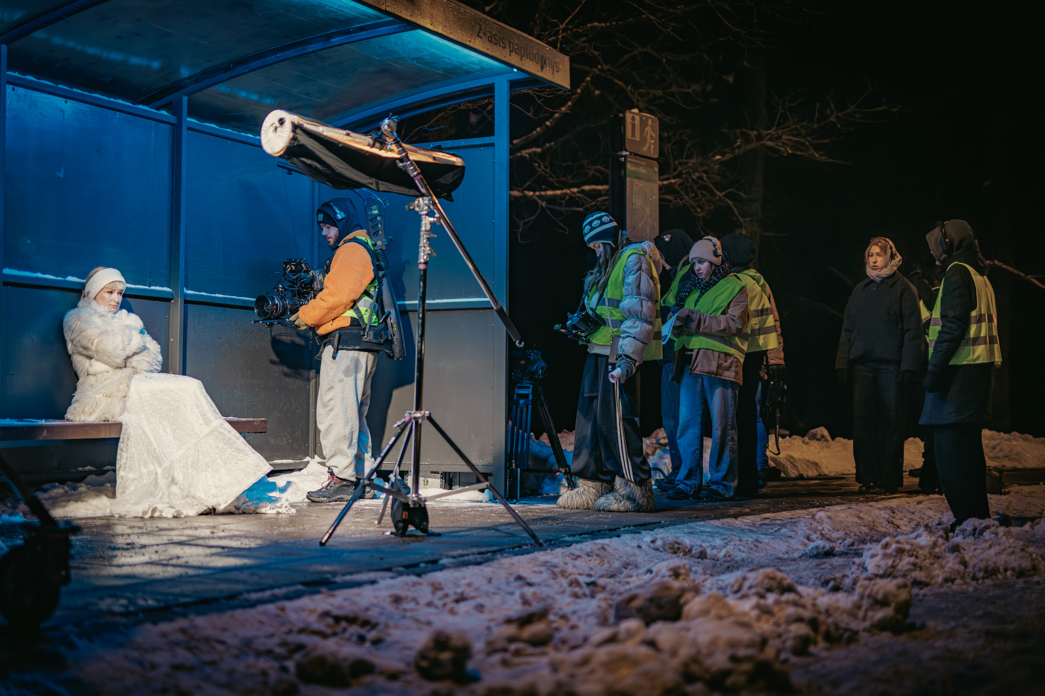 Crew preparing the snowy bus stop scene