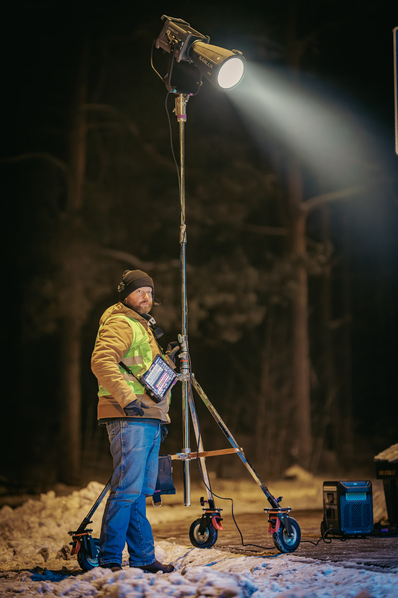 Lighting technician on the winter night shoot