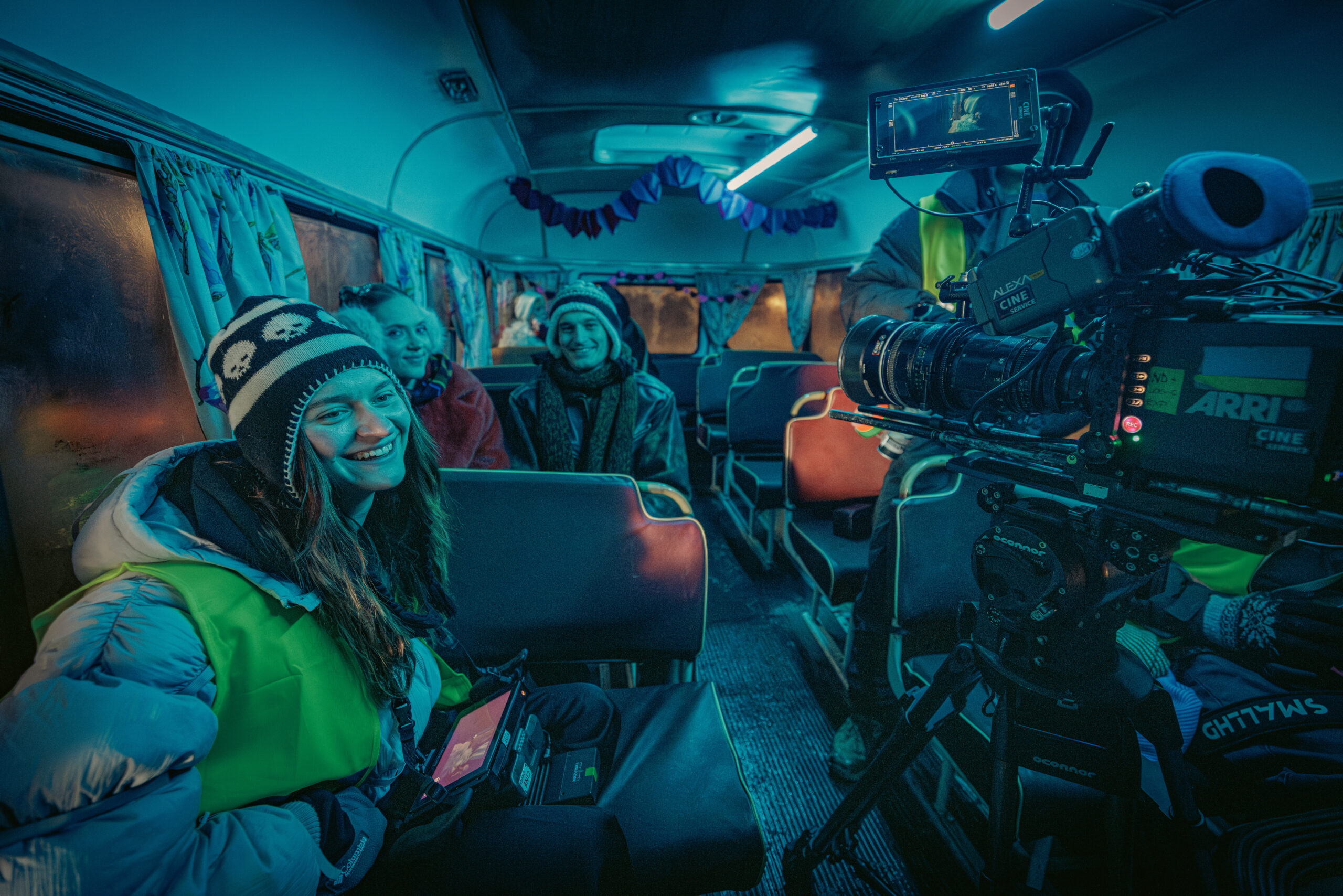 Film crew inside the vintage bus